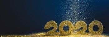 2020 New Year luxury glitter design concept numbers in golden glitters on blue background. 2020 New Year glitter design