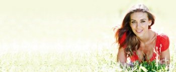 Portrait of young woman in countryside at spring bokeh background with copy space for text. Spring woman portrait