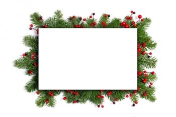 Frame of pine tree and red berry decoration isolated on white background for the text and invitation card for Christmas tradition. Invitation card for Christmas
