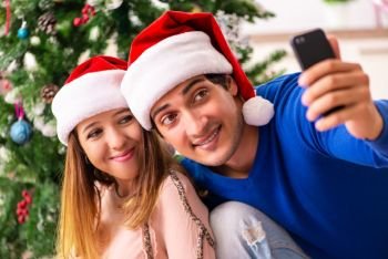 Pregnant wife celevrating christmas with husband