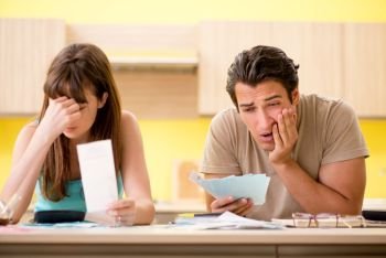 Young family struggling with personal finance. The young family struggling with personal finance