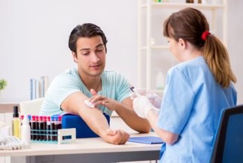 Young patient during blood test sampling procedure  