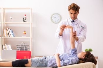 Male doctor checking joint flexibility with goniometer  . Male doctor checking joint flexibility with goniometer 