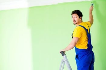 Young painter doing renovation at home 