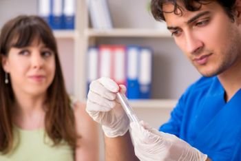 Young woman visiting male doctor dentist for removal of tartar . The young woman visiting male doctor dentist for removal of tartar 