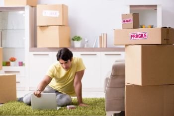 Man moving house and relocating with fragile items