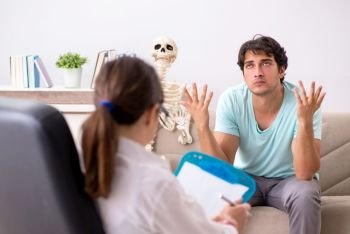 Young patient visiting psychologist for therapy. The young patient visiting psychologist for therapy
