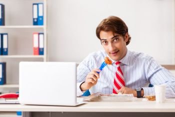 Man having meal at work during break