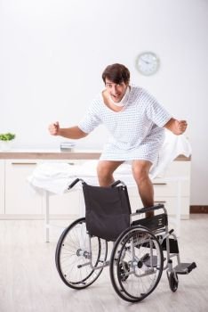 Young handsome man in wheelchair at the hospital 