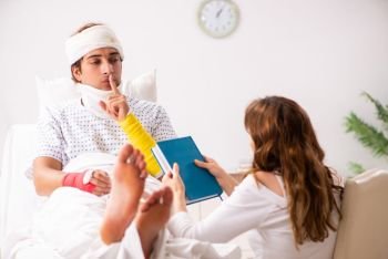 Loving wife looking after injured husband 