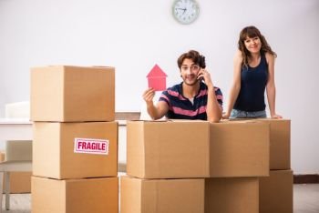 Young family moving to new house apartment