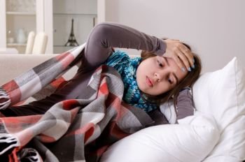 Sick young woman suffering at home 