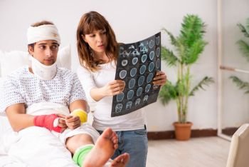 Loving wife looking after injured husband 