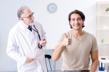 Young male patient visiting old doctor 