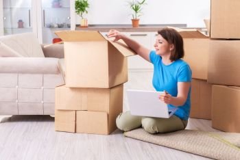 Middle-aged woman moving to new flat 