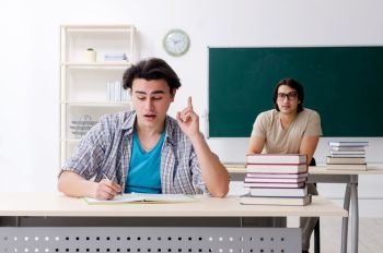 Two male students in the classroom 