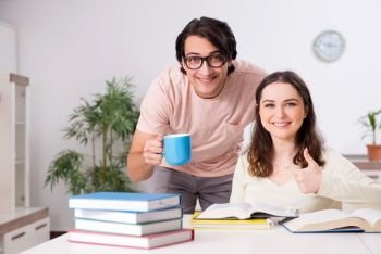 Students preparing for exam together at home 