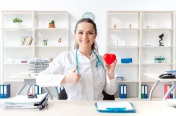 Young female doctor cardiologist working in the clinic 