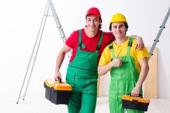 Two workers contractors working indoors  