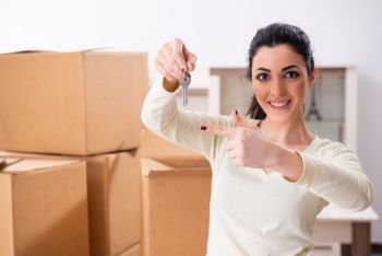 Young woman moving to new flat 