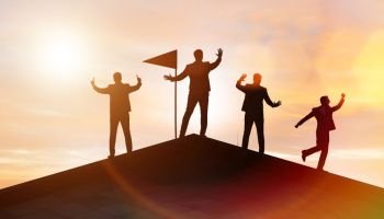 Businessmen in achievement and teamwork concept