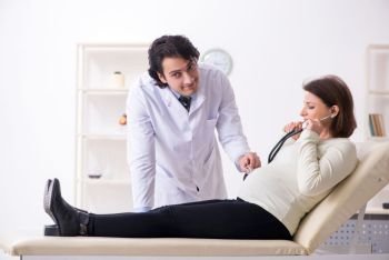 Old pregnant woman visiting young male doctor 