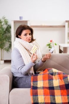 Sick middle-aged woman suffering at home 