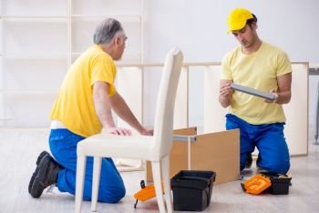 Two contractors carpenters working indoors 