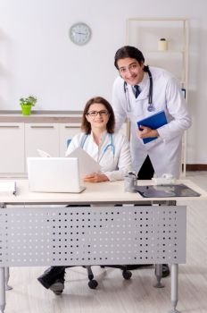 Two doctors working in the clinic 