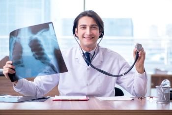 Young male doctor radiologist working in the clinic 