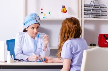 Young woman visiting female doctor otolaryngologist . Young woman visiting female doctor otolaryngologist