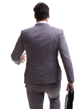 Businessman walking away isolated on white background