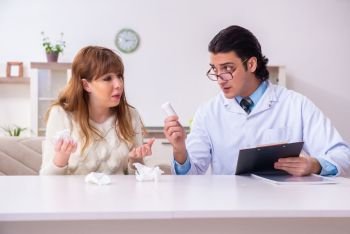 The young female patient discussing with male psychologist personal . Young female patient discussing with male psychologist personal 