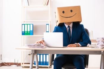 The happy man employee with box instead of his head. Happy man employee with box instead of his head