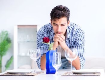 Man alone preparing for romantic date with his sweetheart. The man alone preparing for romantic date with his sweetheart