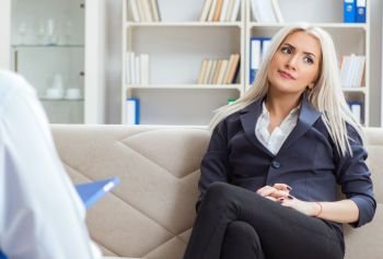 Young woman visiting psychiatrist man doctor for consultation. The young woman visiting psychiatrist man doctor for consultatio