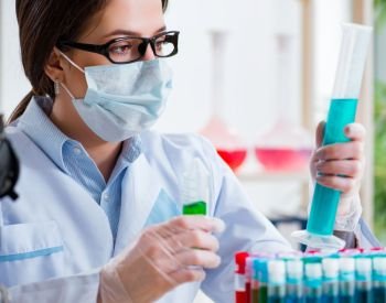 The female chemist working in hospital lab. Female chemist working in hospital lab