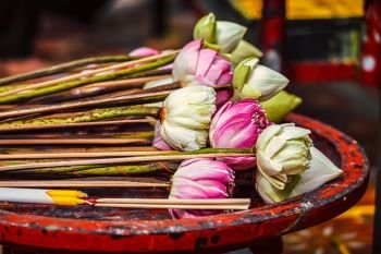 Lotus flowers used as offering in Wat Phra That Doi Suthep Buddhist temple, Chiang Mai, Thailand. Lotus flowers used as offering in Buddhist temple