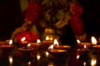 Diwali lights oil candles with Shiva Nataraja in the background for Maha Shivaratri,  India. Diwali lights, India