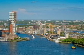 View of Rotterdam city and Nieuwe Maas river with ship from Euromast. View of Rotterdam city and Nieuwe Maas river 