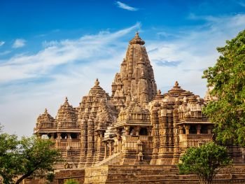 Famous Indian tourist landmark - Kandariya Mahadev Temple, Khajuraho, India. Unesco World Heritage Site. Famous temples of Khajuraho