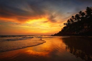 Sunset on Varkala beach popular tourist destination in Kerala state, South India. Sunset on Varkala beach, Kerala, India