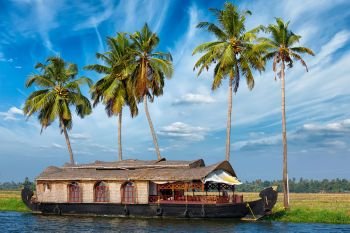 Kerala travel tourism background - houseboat on Kerala backwaters. Kerala, India. Houseboat on Kerala backwaters, India