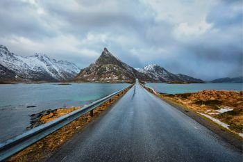 Road in Norwegian fjord. Lofoten islands, Norway. Road in Norway in winter