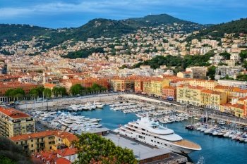 View of Old Port of Nice with luxury yacht boats from Castle Hill, France, Villefranche-sur-Mer, Nice, Cote d’Azur, French Riviera. View of Old Port of Nice with yachts, France