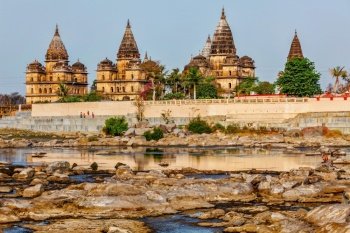Tourist indian landmark - view of Royal cenotaphs of Orchha over Betwa river. Orchha, Madhya Pradesh, India. Royal cenotaphs of Orchha, Madhya Pradesh, India