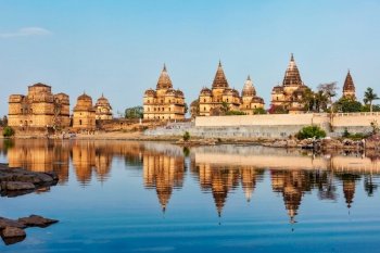 Tourist indian landmark - view of Royal cenotaphs of Orchha over Betwa river. Orchha, Madhya Pradesh, India. Royal cenotaphs of Orchha, Madhya Pradesh, India
