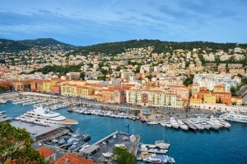 View of Old Port of Nice with luxury yacht boats from Castle Hill, France, Villefranche-sur-Mer, Nice, Cote d’Azur, French Riviera. View of Old Port of Nice with yachts, France