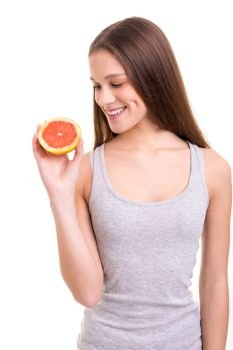 Young woman holding a fresh grapefruit, isolated over white background