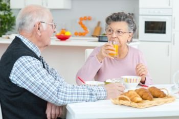 an old couple having breakfast